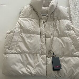 NWT cream puffer vest. Never worn. Missed the return window.